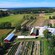 A seaside farming community with trees, open pastures and vegetable crops